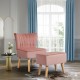 Pink leisure chair with tufted design and ottoman, featuring velvet upholstery and rubber wood legs for stylish comfort.