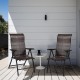 Two folding reclining chairs made of durable PE rattan and steel, perfect for patio or garden relaxation.