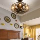 Enclosed ceiling fan with light in matte black, featuring a retro cage design, ideal for small spaces and easy.