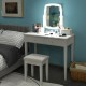 Vanity table set in white with lighted mirror, featuring 10 dimmable bulbs and ample storage, perfect for bedroom use.