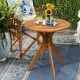 Round 27-inch solid wood coffee side bistro table with X-shaped legs, perfect for outdoor patio or indoor living spaces.