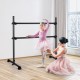 Freestanding black ballet barre for dancing and stretching, adjustable height, suitable for various ages and settings.