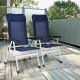 Two blue patio dining chairs with adjustable backrests and foldable design, perfect for outdoor relaxation.