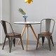 Dark green stackable metal dining chairs with wooden seats, ideal for dining rooms or kitchens, showcasing stability.