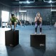 Foam jumping boxes in a gym setting, showcasing 20" and 30" heights for versatile jump training exercises.