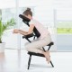 Foldable PU leather travel massage chair with adjustable face cradle and armrest, ideal for relaxation and comfort.