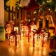 Lighted Christmas gift boxes with red bows and 60 LED lights, perfect for festive indoor and outdoor decoration.