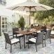 7-piece patio dining set with cushioned armchairs, PE rattan, and acacia wood table, perfect for outdoor gatherings.
