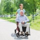 Folding rollator walker in red with 8-inch wheels, used as a wheelchair for mobility support and comfort.