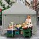 Pop-up gazebo with gray oxford fabric, adjustable height, ideal for outdoor events like markets and parties.