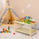 Kids activity play table made of natural pine wood, featuring a removable top and double storage for toys and books.