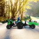 Kids ride-on excavator in green with shovel bucket and trailer, designed for fun and safe outdoor play.