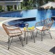 Patio rattan bistro set featuring two armchairs and a side table, perfect for outdoor relaxation by the pool.