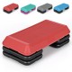 Red adjustable aerobic stepper platform with detachable risers for customizable workout intensity, ideal for home or.