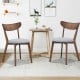 Set of 2 dining chairs with upholstered curved backs and rubber wood legs, ideal for kitchen or dining room use.