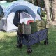 Folding utility garden cart in blue with wide wheels, loaded with bags, ideal for camping and outdoor storage.