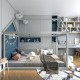 Stable kids platform floor bed with roof in gray, featuring sturdy wooden frame and heavy-duty slats for durability.