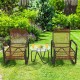 Two ergonomic single chairs with a glass side table in a garden setting, perfect for outdoor patio relaxation.
