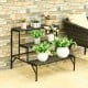 Three-tier metal decorative plant stand with elegant patterns, perfect for indoor or outdoor plant display.