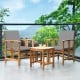 Two acacia wood chairs with gray cushions and a coffee table, perfect for outdoor patio relaxation.