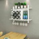 Wall-mounted wine rack organizer with glass holder, storing six bottles, made of MDF and stainless steel for home decor.