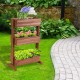3-tier raised garden bed made of solid wood, featuring detachable shelves for versatile plant storage in a garden.