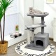 Gray cat tree with perch, condo, and hanging ball for indoor play, featuring soft plush covering and sisal scratching.