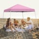 Pink 10 x 10 feet outdoor instant pop-up canopy with friends enjoying a picnic, perfect for camping and gatherings.