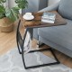 C-shaped vintage end table with a wooden top and metal frame, featuring a side pocket for magazines, ideal for living.