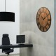 27-inch round wall clock with rustic wood design and metal Roman numerals, ideal for office or coffee bar decoration.