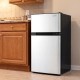 Compact 3.2 cu.ft mini fridge with freezer, adjustable thermostat, and reversible door, perfect for small spaces.