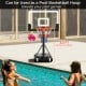Portable adjustable basketball hoop with a 3.3-7 ft height range, ideal for poolside games and outdoor fun.