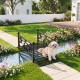 Garden metal bridge with dual patterned side rails, featuring a slatted walkway and arched frame, ideal for landscaping.
