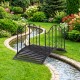 Garden metal bridge with dual patterned side rails, arched design and slatted walkway, perfect for enhancing garden.