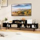 Black 3 cubby TV stand with open storage compartments, suitable for TVs up to 70 inches, ideal for living room use.