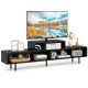 Black 3 cubby TV stand for TVs up to 70 inches, featuring open storage compartments and raised metal legs.
