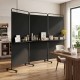 3-panel black room divider with shelves, featuring lockable wheels, ideal for creating privacy in living spaces.