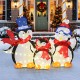 Lighted 3-piece penguin family Christmas decoration with 160 LED lights, featuring festive hats and red scarves for.
