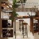 Rustic brown 3-piece bar table set with wine rack, spacious tabletop, and integrated glass holders for versatile use.