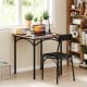 Rustic brown dining table set with two chairs, featuring PU leather cushions and ergonomic design for comfort.