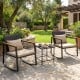 Outdoor rocking chairs with soft cushions and a tempered glass coffee table, perfect for garden relaxation.