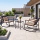 Outdoor rocking bistro set featuring two wicker chairs with soft cushions and a tempered glass coffee table for patio.