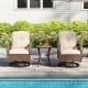 Two brown patio swivel rockers with thick cushions beside a stylish tempered glass side table by the poolside.