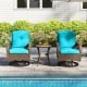Turquoise cushioned patio swivel rockers with a tempered glass side table, perfect for poolside relaxation.