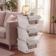 Stackable gray storage bins with stay-open lids, featuring wheels for easy mobility, ideal for organizing various.