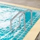 3-step stainless steel swimming pool ladder with anti-slip steps and curved handrails for safety and convenience.