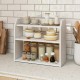 Three-tier white wooden countertop bookshelf with raised guardrails, ideal for organizing books and kitchen items.