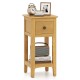Natural wood 3-tier nightstand with drawer and open shelf, perfect for cozy corners in living rooms or bedrooms.