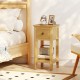Natural 3-tier nightstand with a drawer and open shelf, perfect for bedside storage and display in a cozy bedroom.
