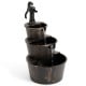 3-tier outdoor barrel waterfall fountain with vintage bronze finish and electric pump for a relaxing garden retreat.